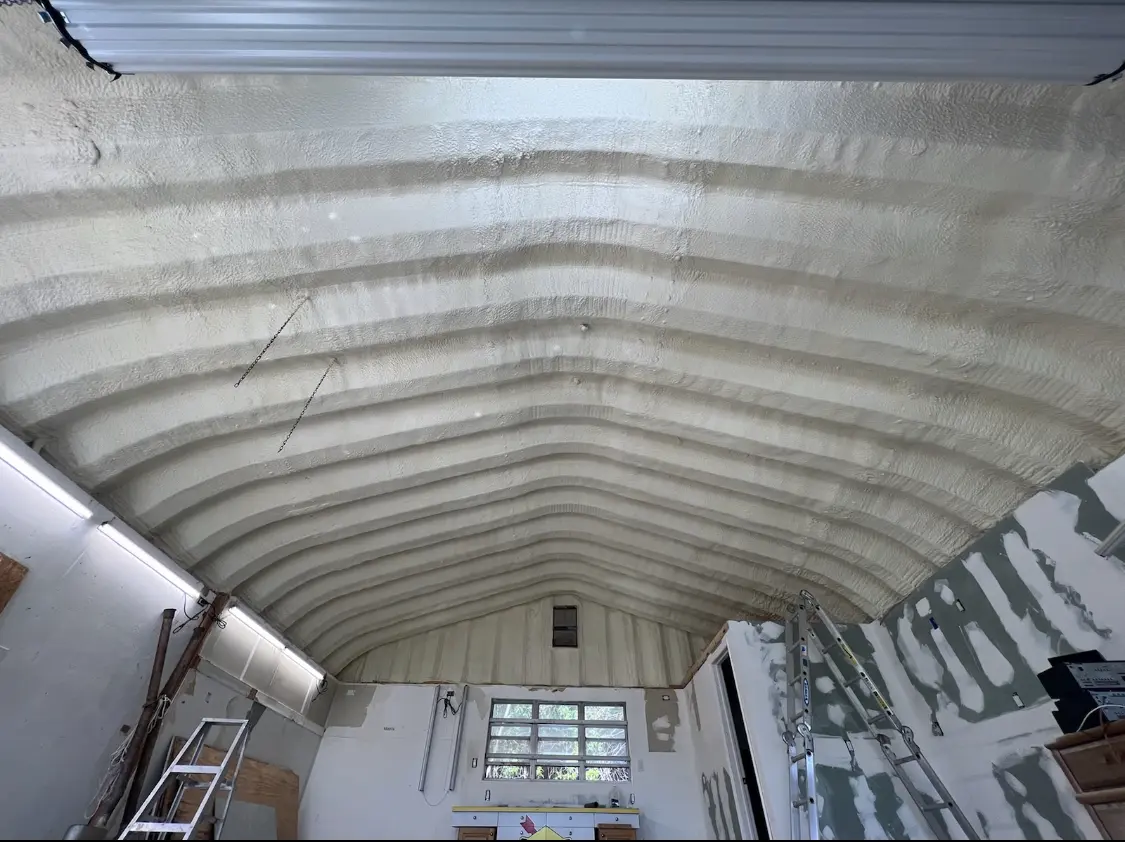 Spray polyurethane foam applied to the underside of a metal roof deck in Menlo Park